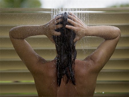 simsearch:640-01366031,k - Rear view of an adult woman taking a shower bath Foto de stock - Sin royalties Premium, Código: 640-01364447