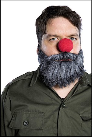 simsearch:640-01360385,k - Portrait of a mid adult man with a clown's nose Stock Photo - Premium Royalty-Free, Code: 640-01364482