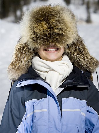 simsearch:640-01349275,k - Close-up of a girl wearing a fur hat Foto de stock - Sin royalties Premium, Código: 640-01364596