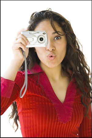 simsearch:640-03255699,k - Woman in red shirt taking picture with digital camera Foto de stock - Sin royalties Premium, Código: 640-01364722