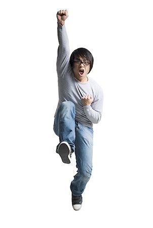 simsearch:640-01358873,k - Portrait of a mid adult man jumping Stock Photo - Premium Royalty-Free, Code: 640-01364753