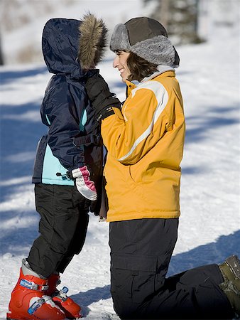 ski boots - Woman with young girl in ski boots outdoors Stock Photo - Premium Royalty-Free, Code: 640-01364840