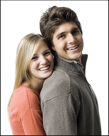 simsearch:640-03257281,k - Portrait d'une jeune femme embrassant un jeune homme Photographie de stock - Premium Libres de Droits, Code: 640-01364908