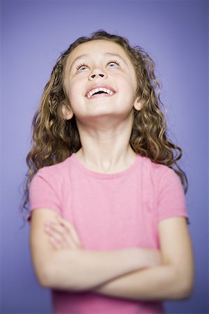 Close-up of a girl standing with her Arms Crossed, Arms Folded Stock Photo - Premium Royalty-Free, Code: 640-01364953