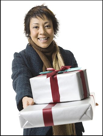 simsearch:640-01363954,k - Portrait of a young woman holding gifts Foto de stock - Sin royalties Premium, Código: 640-01364975