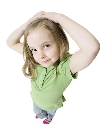 High angle view of a girl standing with her hands on her head Stock Photo - Premium Royalty-Free, Code: 640-01365031