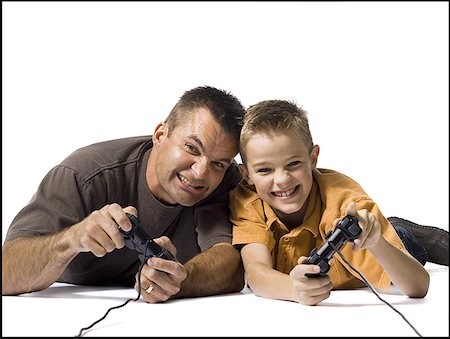 simsearch:640-02770204,k - Father and son playing a video game Foto de stock - Royalty Free Premium, Número: 640-01365086