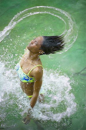 High angle view of a young woman standing in a lake Stock Photo - Premium Royalty-Free, Code: 640-01365082