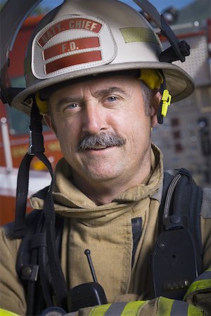firefighter close - Close-up of a firefighter smiling Stock Photo - Premium Royalty-Free, Code: 640-01365165