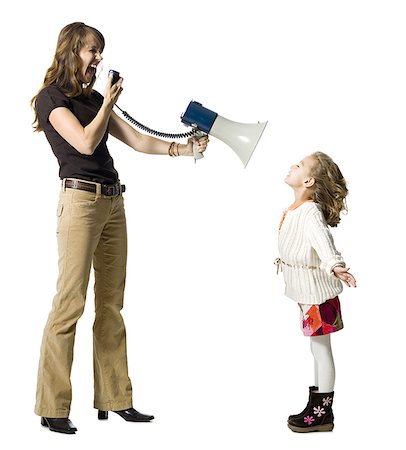 Woman yelling at daughter through megaphone Foto de stock - Royalty Free Premium, Número: 640-01365176