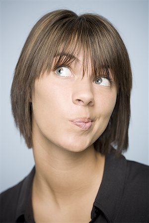 Close-up of a teenage girl making a face Stock Photo - Premium Royalty-Free, Code: 640-01365222