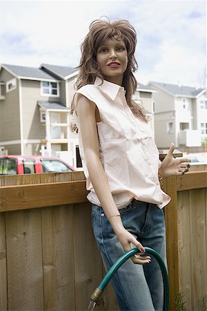 Mannequin of a woman holding a water pipe Fotografie stock - Premium Royalty-Free, Codice: 640-01365249