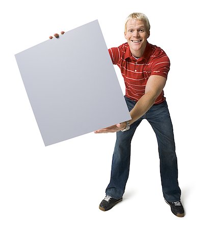 simsearch:640-01356873,k - Portrait of a young man holding a blank sign Stock Photo - Premium Royalty-Free, Code: 640-01365278