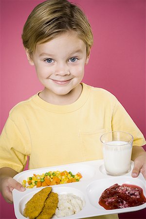 Boy with tray of food Stock Photo - Premium Royalty-Free, Code: 640-01365293