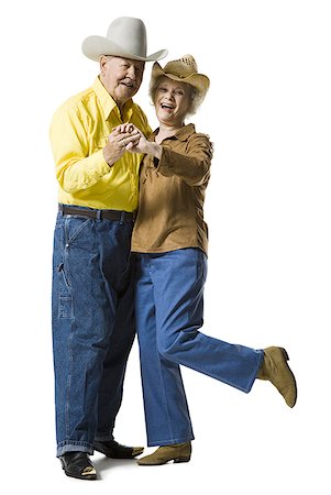 Older couple in western clothing dancing Stock Photo - Premium Royalty-Free, Code: 640-01365307