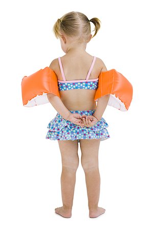 Young girl with personal flotation devices around arms Foto de stock - Sin royalties Premium, Código: 640-01365317