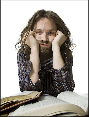 Portrait of a young man thinking Stock Photo - Premium Royalty-Free, Code: 640-01365338