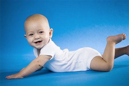 simsearch:640-01351279,k - Baby on belly smiling Stock Photo - Premium Royalty-Free, Code: 640-01365519