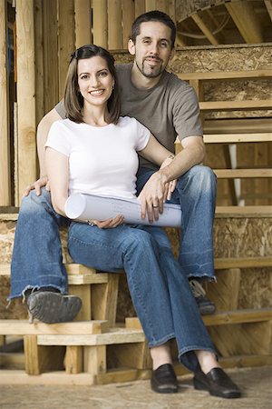 pictures people sitting front steps house - Portrait of a young couple sitting on the staircase and smiling Stock Photo - Premium Royalty-Free, Code: 640-01365538