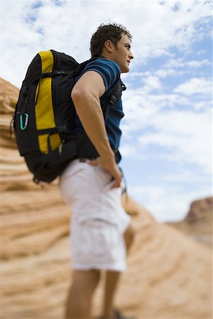 Profile of a young man carrying a backpack Stock Photo - Premium Royalty-Free, Code: 640-01365571