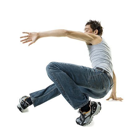 Profile of a young man break dancing Stock Photo - Premium Royalty-Free, Code: 640-01365635