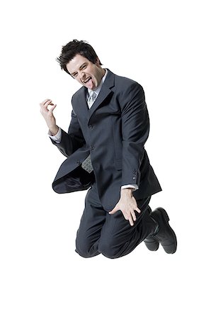 simsearch:640-01360385,k - Portrait of a businessman making a face and jumping in mid air Stock Photo - Premium Royalty-Free, Code: 640-01365792