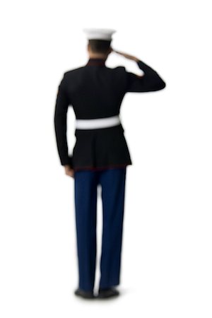 Rear view of a navy officer saluting Stock Photo - Premium Royalty-Free, Code: 640-01365841