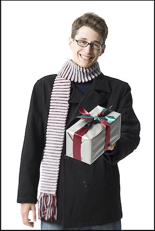 striped wrapping paper - Portrait of a young man holding a gift Stock Photo - Premium Royalty-Free, Code: 640-01366033