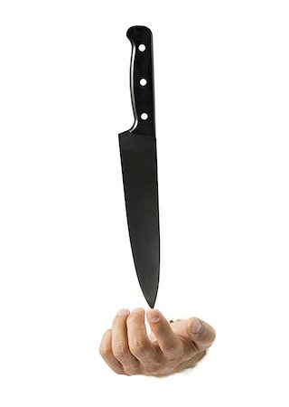 Close-up of a knife in a man's hand Foto de stock - Sin royalties Premium, Código: 640-01366111