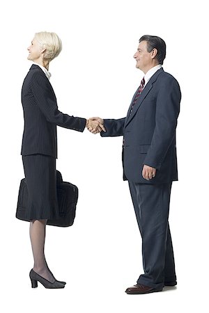 Businesswoman with head backwards shaking hands with businessman Stock Photo - Premium Royalty-Free, Code: 640-01366162