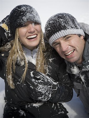 funny freezing cold photos - Portrait of a young couple smiling Stock Photo - Premium Royalty-Free, Code: 640-01366205