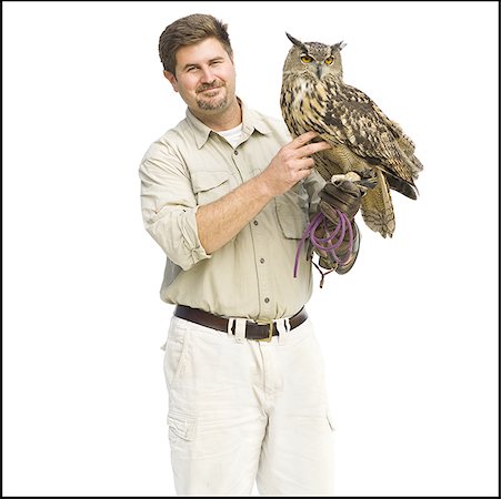 european eagle owl - Animal handler with owl Foto de stock - Sin royalties Premium, Código: 640-01366213