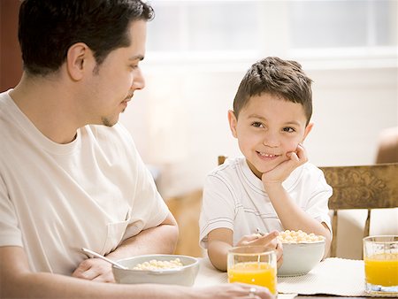simsearch:640-03262648,k - Father and young son having breakfast together Stock Photo - Premium Royalty-Free, Code: 640-01366226