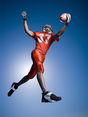 someone catching a football - Football player Stock Photo - Premium Royalty-Free, Code: 640-01366266