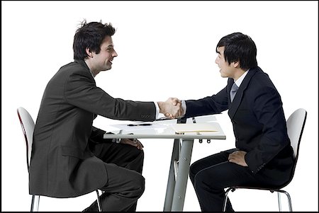 Profile of two businessmen shaking hands Stock Photo - Premium Royalty-Free, Code: 640-01366277