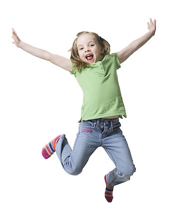 Portrait of a girl jumping in mid air Stock Photo - Premium Royalty-Free, Code: 640-01366335