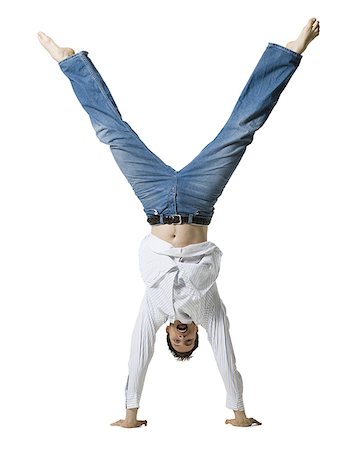 Man doing handstand Stock Photo - Premium Royalty-Free, Code: 640-01366338