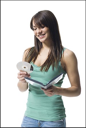 dvd - Young woman holding a DVD Stock Photo - Premium Royalty-Free, Code: 640-01366352