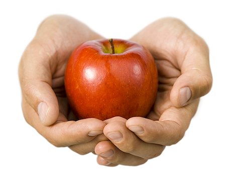 Close-up of hands holding an apple Stock Photo - Premium Royalty-Free, Code: 640-01366516