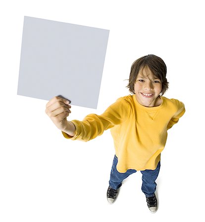 simsearch:640-01360910,k - Portrait of a boy holding a placard Stock Photo - Premium Royalty-Free, Code: 640-01366538