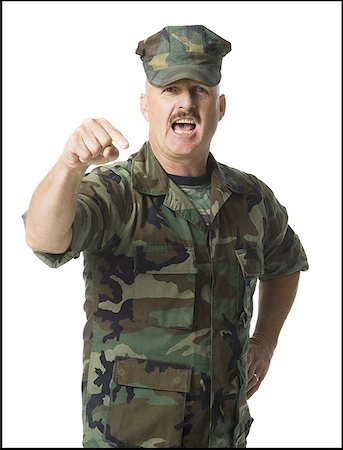 simsearch:640-01359391,k - Portrait of a male soldier shouting and gesturing with his finger Foto de stock - Royalty Free Premium, Número: 640-01360054