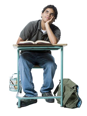 Teenage boy thinking with his hand on his chin Stock Photo - Premium Royalty-Free, Code: 640-01360057