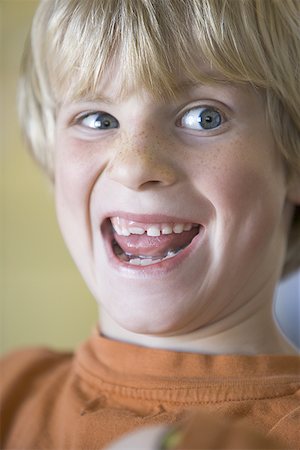 Close-up of a boy looking sideways Stock Photo - Premium Royalty-Free, Code: 640-01360071