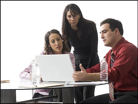 simsearch:628-01495138,k - Close-up of a businessman and two businesswomen having a meeting Stock Photo - Premium Royalty-Free, Code: 640-01360130