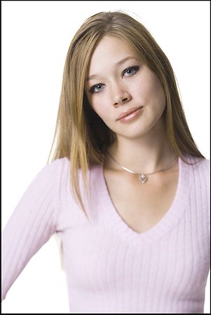 Portrait of a young woman posing Stock Photo - Premium Royalty-Free, Code: 640-01360213