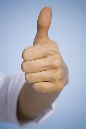 success excellence - Close-up of a person's hand giving a thumbs up gesture Stock Photo - Premium Royalty-Free, Code: 640-01360336