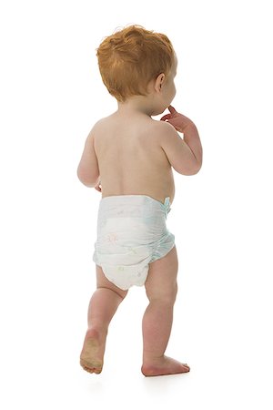 Rear view of a baby boy walking Stock Photo - Premium Royalty-Free, Code: 640-01360330