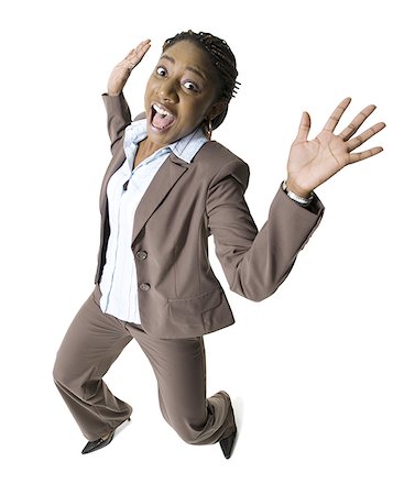 Portrait of a businesswoman making a face with her arms raised Stock Photo - Premium Royalty-Free, Code: 640-01360585