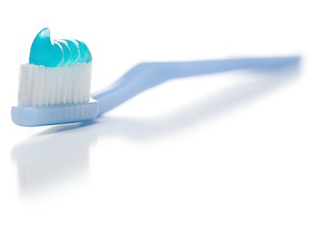 Close-up of toothpaste on a toothbrush Stock Photo - Premium Royalty-Free, Code: 640-01360606