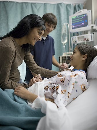 preteen asian girls bed - Profile of a mother talking with her daughter and son in a hospital Stock Photo - Premium Royalty-Free, Code: 640-01360629